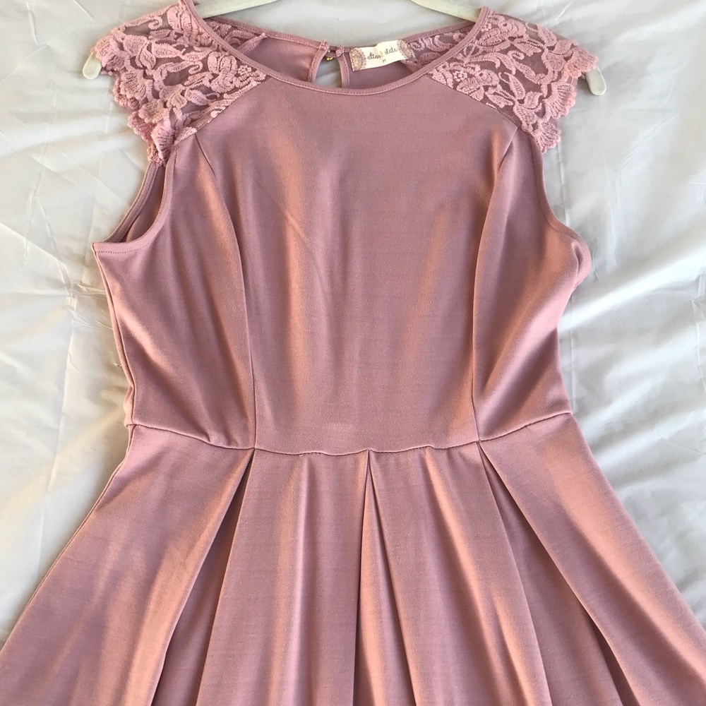 Knee length pink embroidered dress.